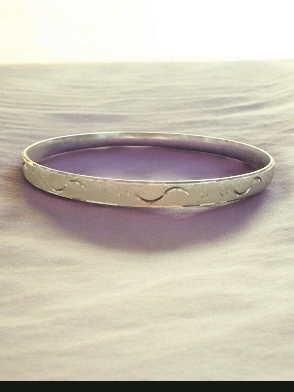 Silver Tone Women's Bangle Bracelet with Subtle Wave Pattern
931